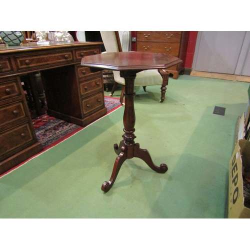 4188 - A Victorian mahogany octagonal tilt-top wine table on a turned column and scroll foot tripod table, ... 