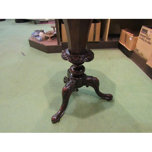 4195 - A Victorian burr walnut octagonal top trumpet sewing table on carved tripod feet, 75cm tall