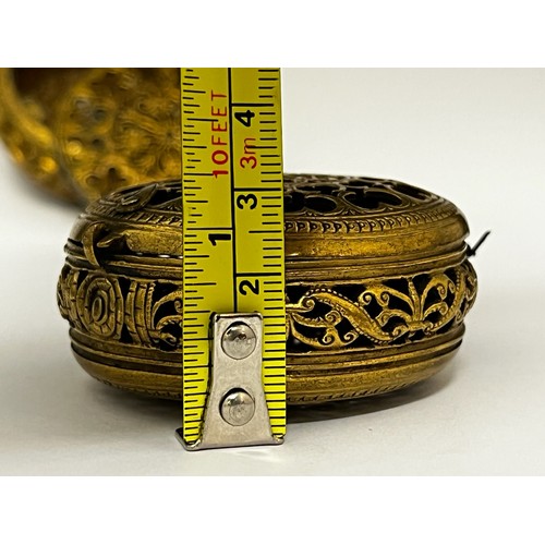 5114 - Two 17th Century German striking watch cases, pierced gilt metal foliate scrolls, hinges a/f, 6.5cm ... 