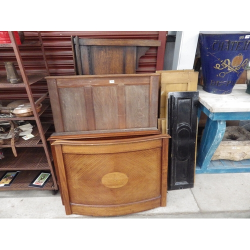 2075 - A quantity of oak and mahogany bed ends, four Victorian scumble pine panels