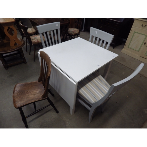 2391 - A matched set of three modern grey painted kitchen chairs with striped upholstery and a table