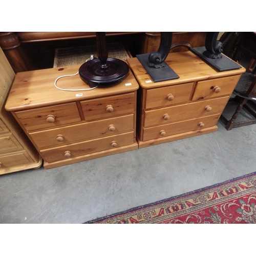 2405 - A pair of country pine bedside chests, each with two short over two long drawers, plinth base