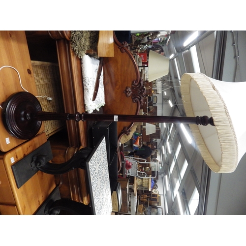 2406 - A mahogany standard lamp