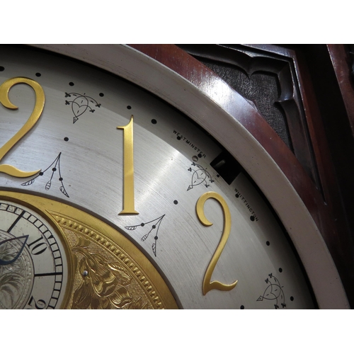 8001 - A Victorian carved oak Gothic style chiming longcase clock, attributed to J.J. Elliot. The hood with... 