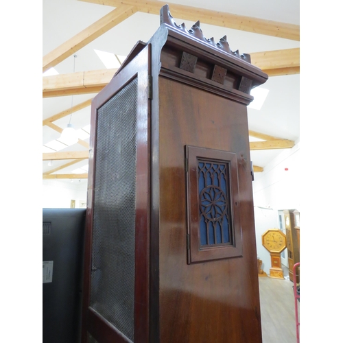 8001 - A Victorian carved oak Gothic style chiming longcase clock, attributed to J.J. Elliot. The hood with... 