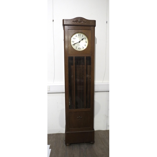 8008 - An oak longcase clock, with silvered Arabic dial, front door with three bevel edged glazed panels, w... 