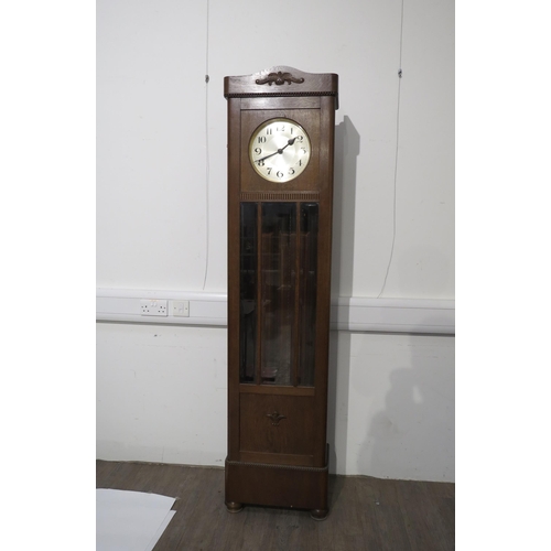 8008 - An oak longcase clock, with silvered Arabic dial, front door with three bevel edged glazed panels, w... 