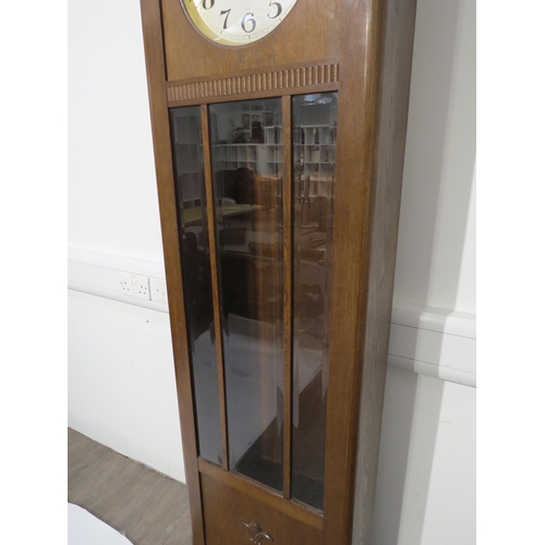 8008 - An oak longcase clock, with silvered Arabic dial, front door with three bevel edged glazed panels, w... 