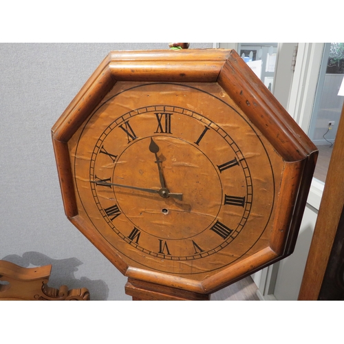 8009 - A mid 19th Century pine tavern clock with large octagonal dial, the brown Roman numeral dial attache... 