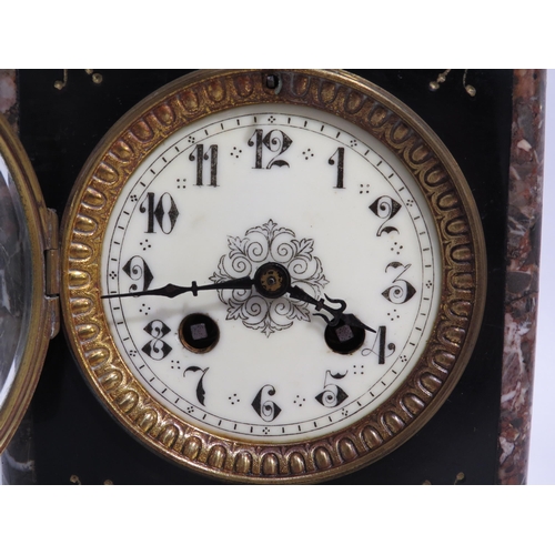 8071 - A marble mantel clock with cream enamel Arabic dial, movement stamped AM striking a bell