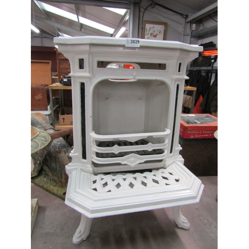 2029 - A white-painted cast iron stove 57cm tall