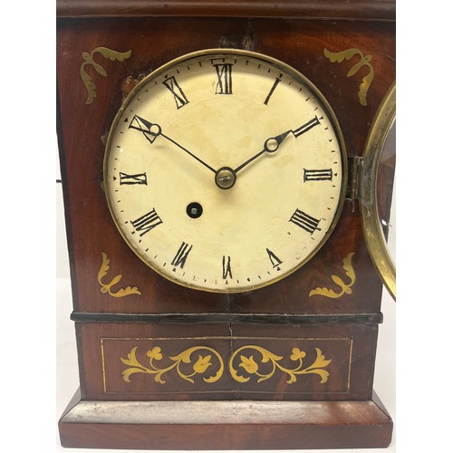 5005 - A 19th Century flame mahogany and brass inlaid mantel clock, re-painted convex dial with blued steel... 