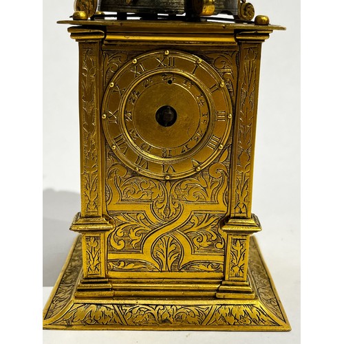 5022 - An early 17th Century German engraved gilt brass striking tabernacle style clock. The winged figure ... 