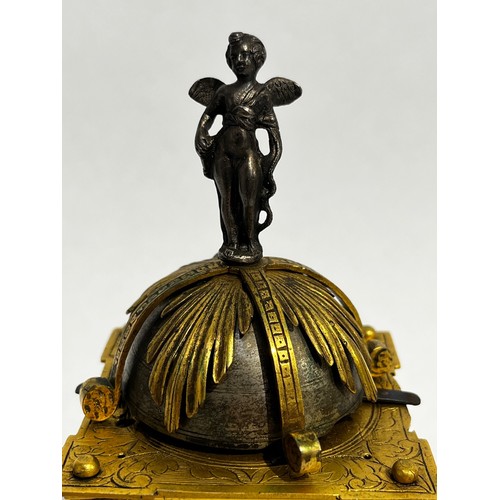 5022 - An early 17th Century German engraved gilt brass striking tabernacle style clock. The winged figure ... 