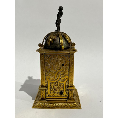 5022 - An early 17th Century German engraved gilt brass striking tabernacle style clock. The winged figure ... 