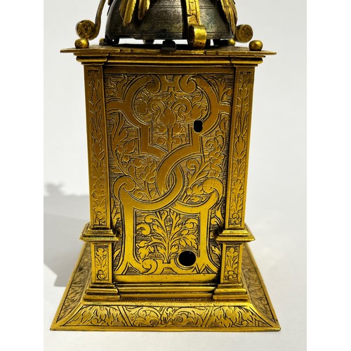 5022 - An early 17th Century German engraved gilt brass striking tabernacle style clock. The winged figure ... 