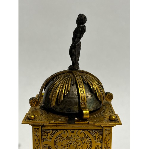 5022 - An early 17th Century German engraved gilt brass striking tabernacle style clock. The winged figure ... 