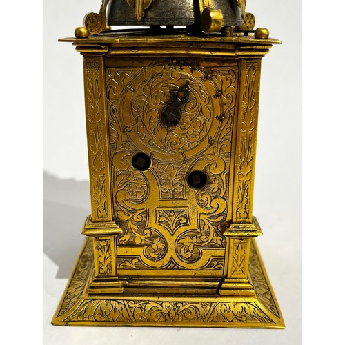 5022 - An early 17th Century German engraved gilt brass striking tabernacle style clock. The winged figure ... 