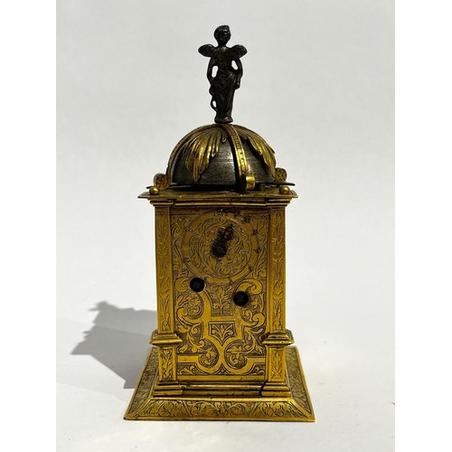 5022 - An early 17th Century German engraved gilt brass striking tabernacle style clock. The winged figure ... 