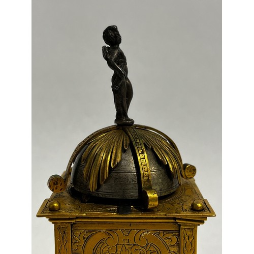 5022 - An early 17th Century German engraved gilt brass striking tabernacle style clock. The winged figure ... 