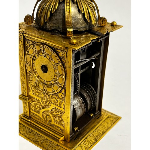 5022 - An early 17th Century German engraved gilt brass striking tabernacle style clock. The winged figure ... 