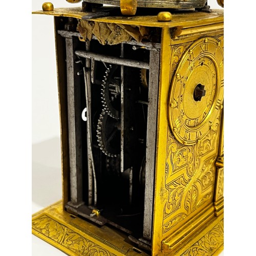 5022 - An early 17th Century German engraved gilt brass striking tabernacle style clock. The winged figure ... 