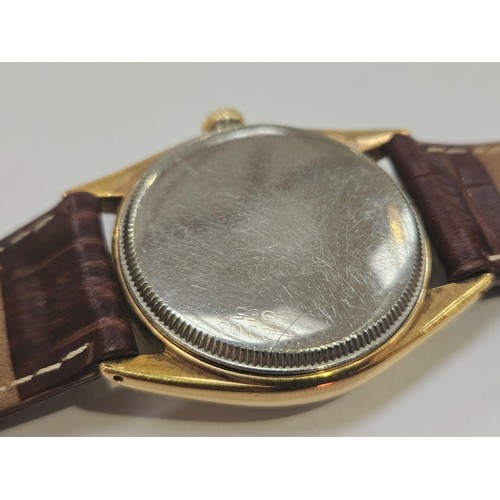 8152 - ROLEX: A Rolex Oyster gentleman's wristwatch on leather strap, the gold plated case with screw on st... 