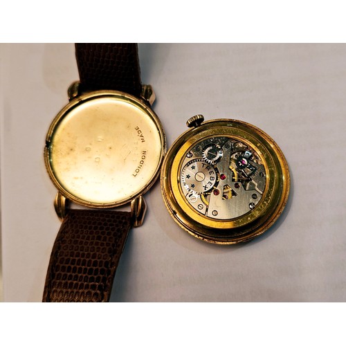 8170 - A 1950's 'Trebex' 9ct gold cased gentleman's wristwatch, Arabic numerated dial, Deco style lugs, on ... 