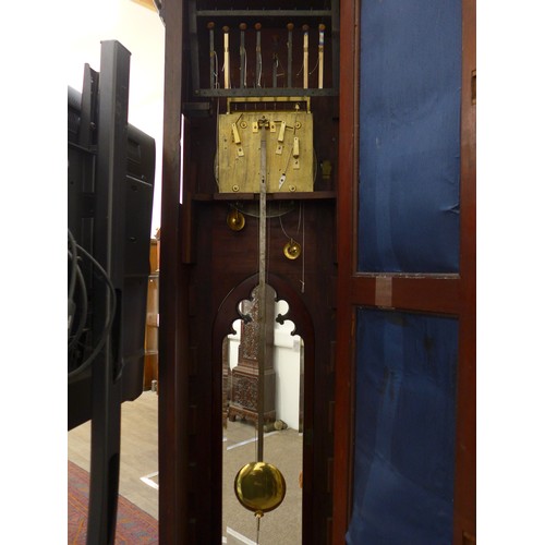 8001 - A Victorian carved oak Gothic style chiming longcase clock, attributed to J.J. Elliot. The hood with... 