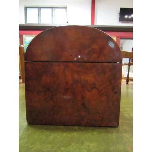 4160 - A Victorian burr walnut domed top brass bound tea caddy with Bramah lock, 