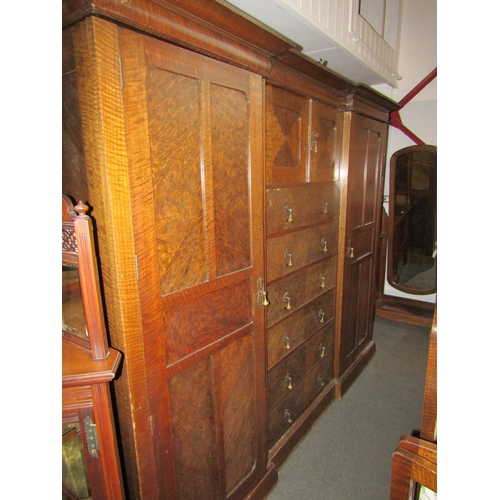 1010 - An early 20th Century compactum, two cupboard doors over six drawers flanked by two doors, 186cm tal... 