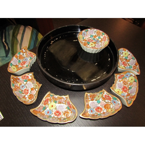 1029 - A Japanese Lazy Susan with ceramic gilt and floral design sections, one a/f, 33cm diameter