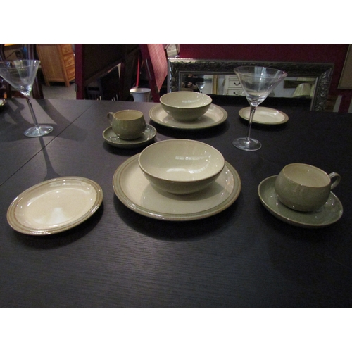 1030 - A collection of Denby stoneware dinner wares in two colour ways