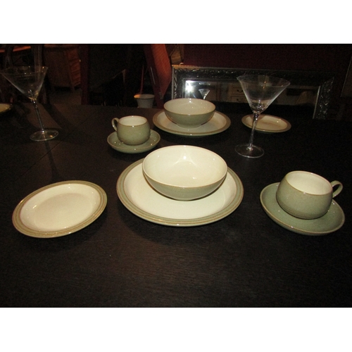 1030 - A collection of Denby stoneware dinner wares in two colour ways