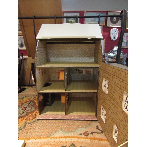 1104 - An early-mid 20th Century dolls house with a tub of assorted furniture, figures etc.