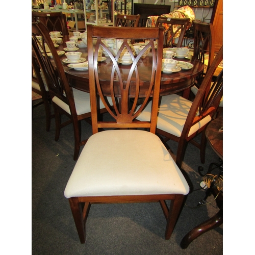 1112 - A 19th Century style reproduction dining table (scratches to top) with eight matching chairs