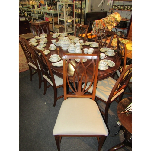 1112 - A 19th Century style reproduction dining table (scratches to top) with eight matching chairs