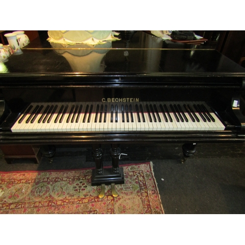 1123 - A C.Bechstein boudoir grand piano in ebonised case. Ivory Licence Ref E9CLTXTQ