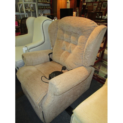 1138 - A Sherborne oatmeal upholstered button back armchair electric operated reclining chair