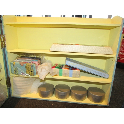 1198 - A handmade wooden opening shelved unit containing miniature milliner's and shop display items etc.