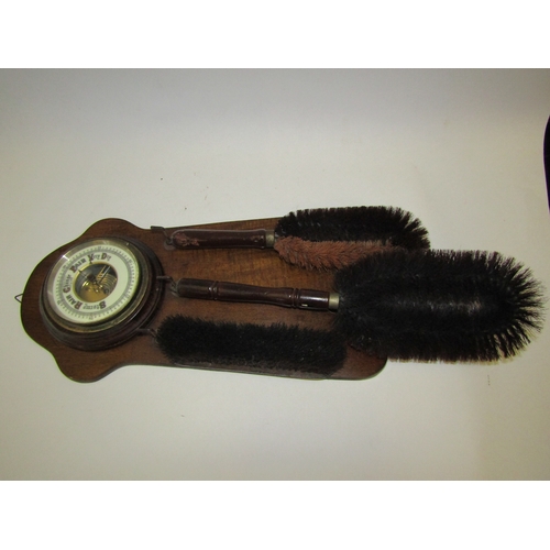 1250 - An aneroid barometer / brush rack