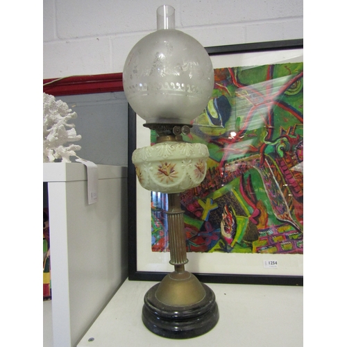 1255 - A Victorian brass oil lamp with green hand painted reservoir, approximately 67cm tall