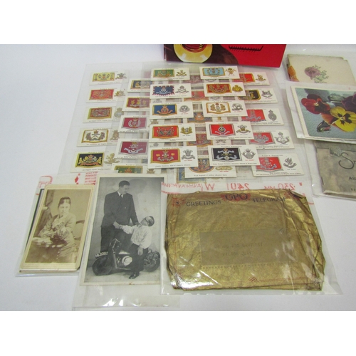 1290 - A stamp album containing some worldwide stamps, a set of Players Cap badges, cigarette cards. drums,... 