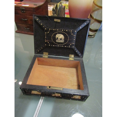 1442 - A porcupine quill box with key. Bone inlaid elephant and 