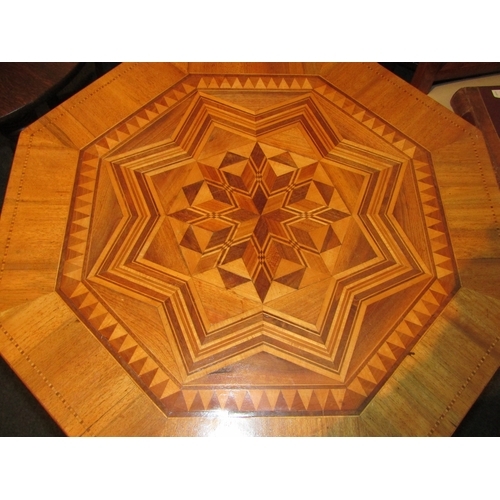 1107 - An octagonal top marquetry tripod table with turned column, 75cm tall x 64cm wide