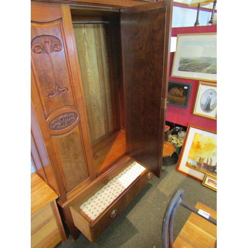 1078 - An Art Nouveau walnut wardrobe, central mirrored door, carved panels, single drawer to base, square ... 