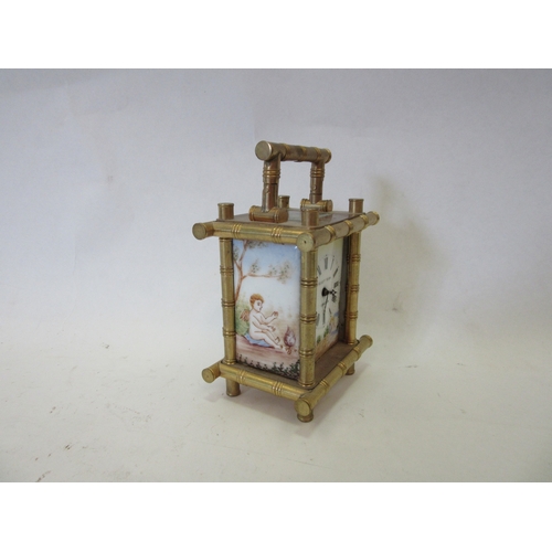 1308 - An Elliott & Sons miniature carriage timepiece with faux bamboo brass case set with painted porcelai... 