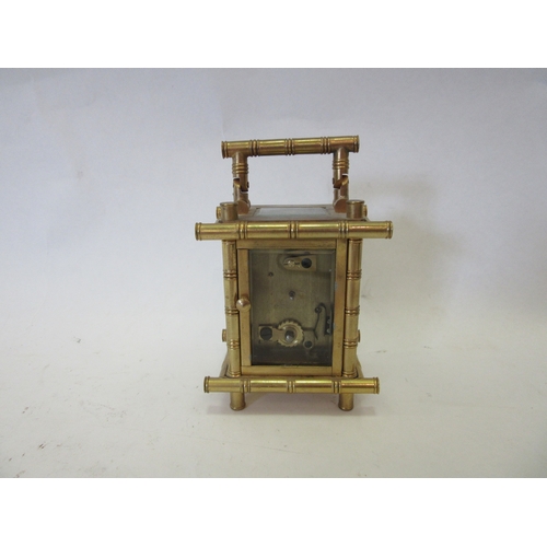 1308 - An Elliott & Sons miniature carriage timepiece with faux bamboo brass case set with painted porcelai... 