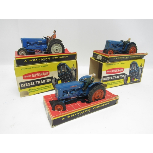 5118 - Two boxed Britains farm issue diecast Fordson Super Major Diesel Tractors, together with another unb... 