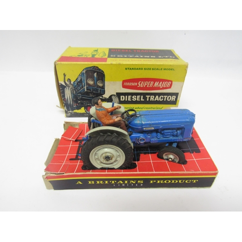 5118 - Two boxed Britains farm issue diecast Fordson Super Major Diesel Tractors, together with another unb... 